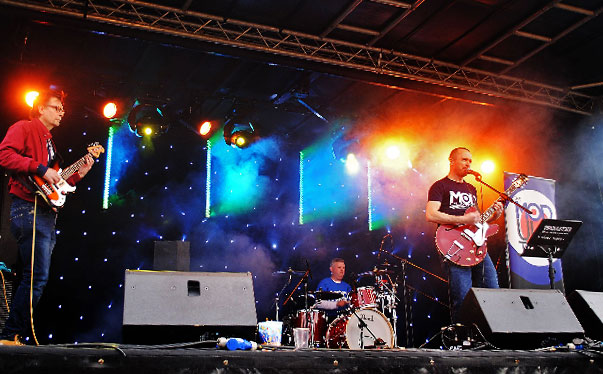 A photo of the band performing on stage