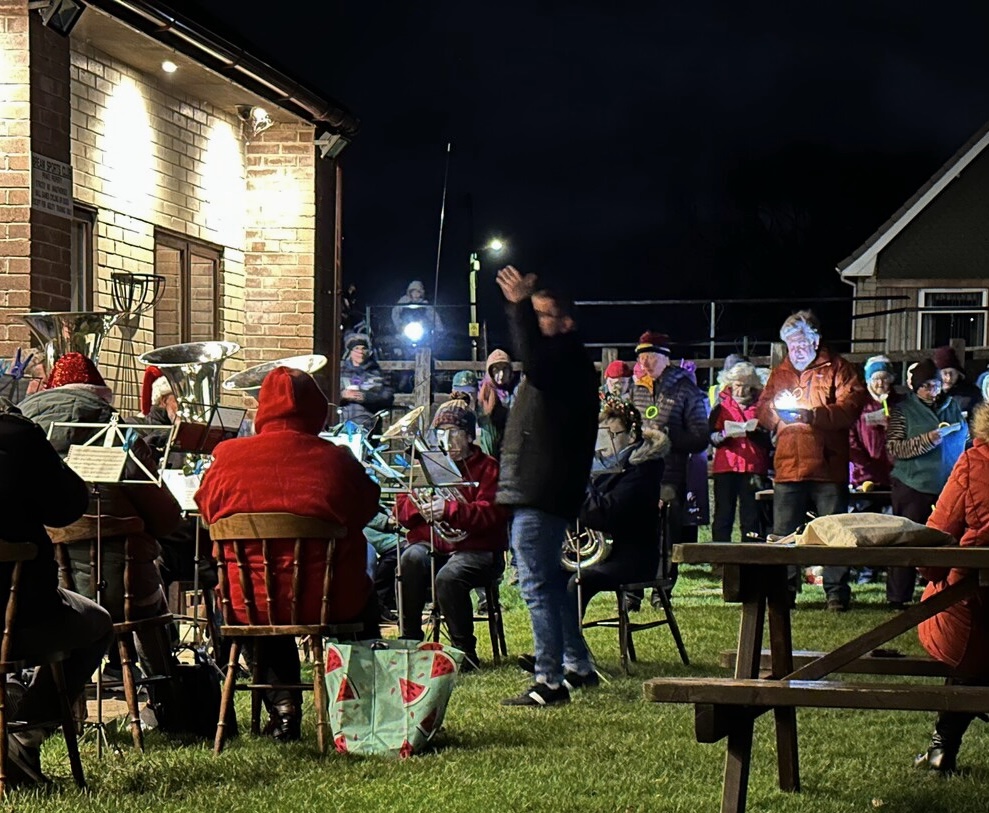 A photo of the outdoor carol servce.