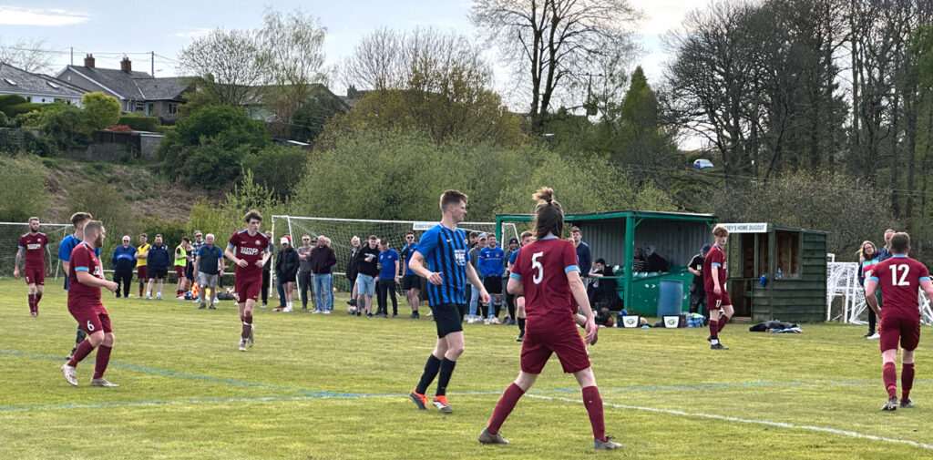 A photo of a crowd watching the football at the Lonk.