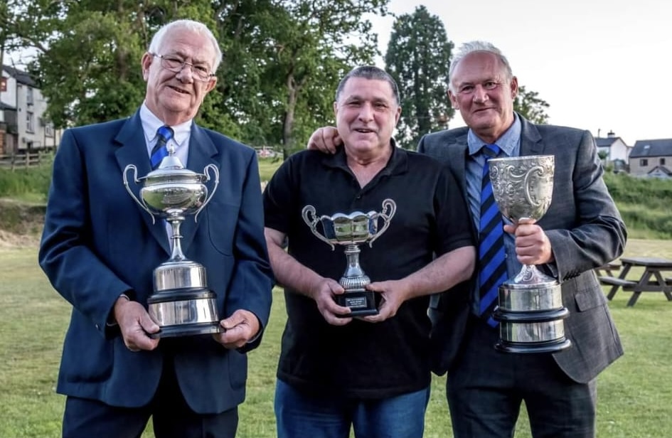 A photo of The Three Amigos with three cups